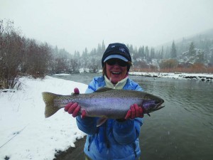 Shelley Walchak cradles a prized rainbow trout on the Yampa River in the Sarvis Creek Wilderness Area outside of Steamboat Springs. Photo by Rob Burden of Steamboat Flyfisher 