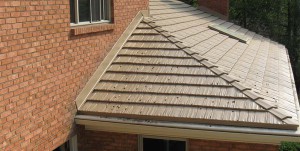  The completed metal roofing with new flashing and decorative hip trim over the seam.  