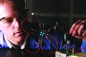 A researcher works with organic light emitting diodes, a lightweight, energy-efficient and flexible light source. 