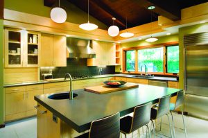 Natural lighting, combined with overhead and task lighting, can make a kitchen functional and energy efficient. Photo Credit: Flickr user angryfrench 