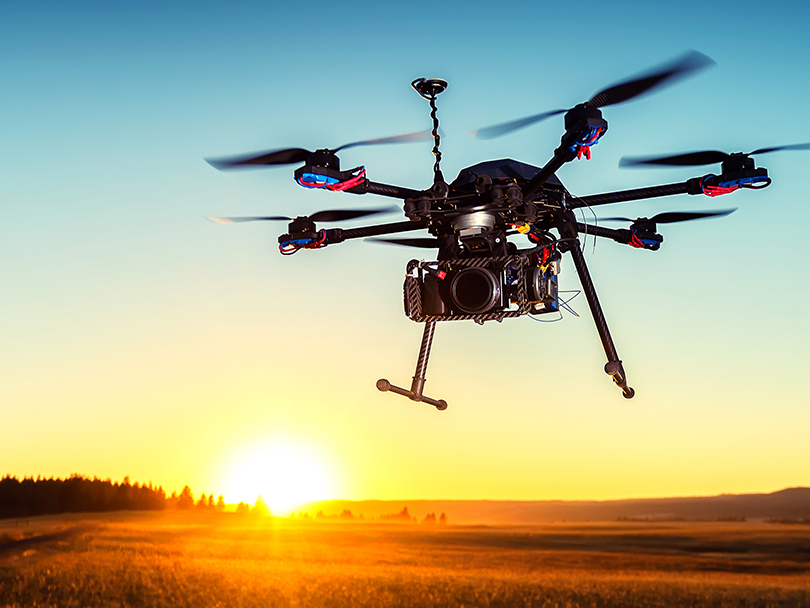 A drone flying above grasslands