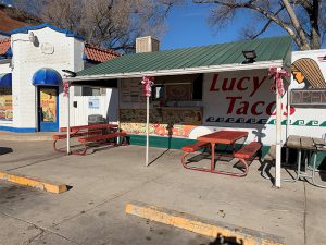 Outside the Lucy's Tacos food truck and converted gas station