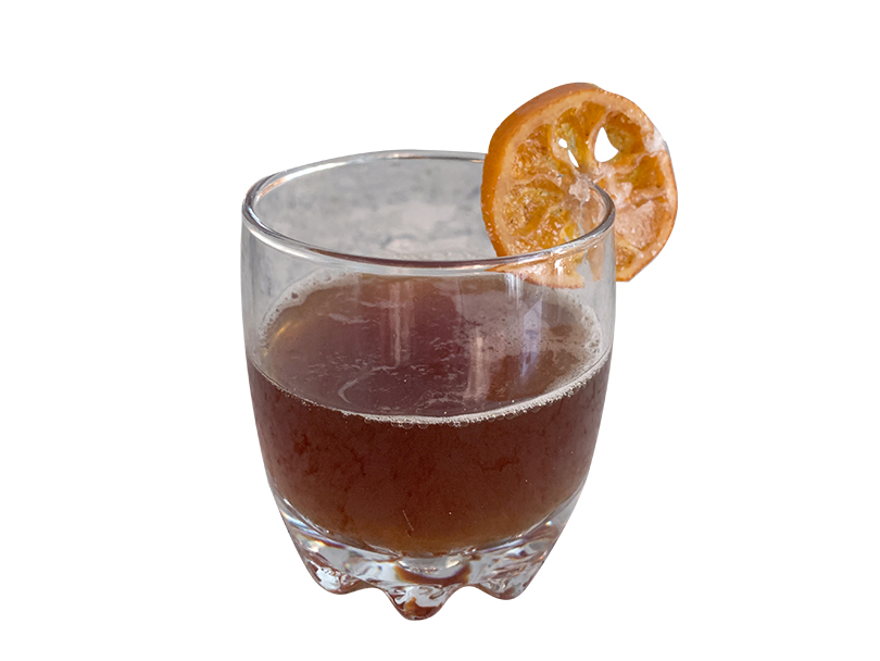 Old fashioned mocktail with a candied orange slice