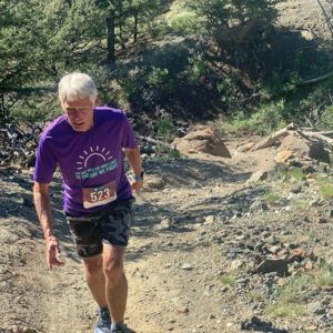 Mace climbs a steep hill at a trail running race in Salida, Colorado, in 2021.