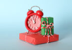 Alarm clock on a present package to indicate last minute gifts