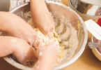 hands in a mixing bowl
